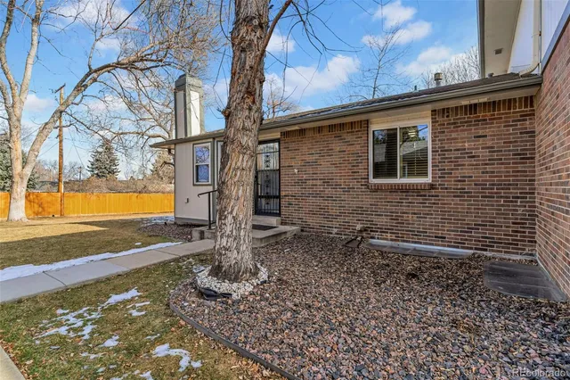 a backyard of a house with barbeque oven
