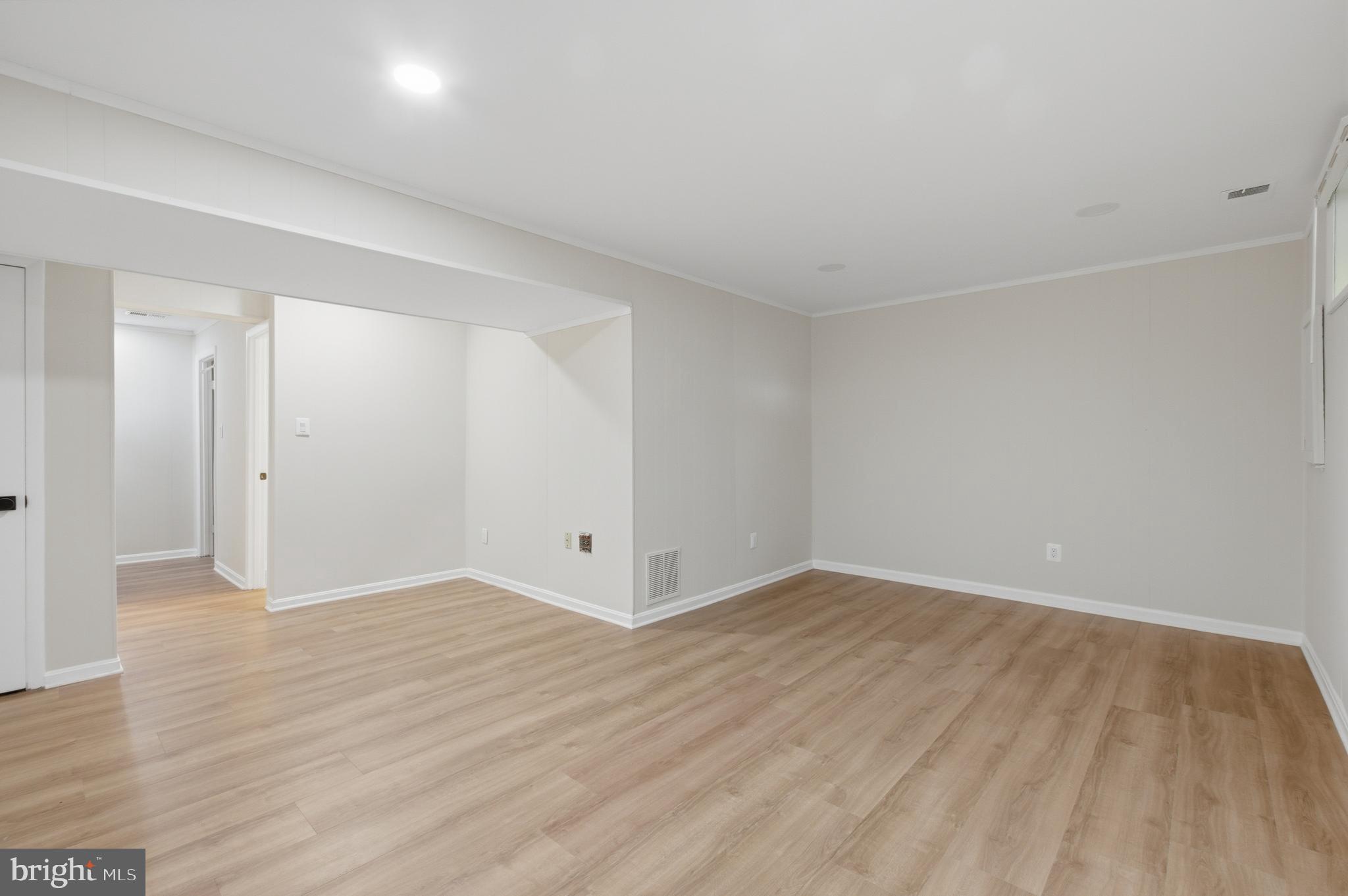 8575 Tyrolean Way Springfield, VA 22153 - Photo 23 of 29 a view of an empty room and wooden floor