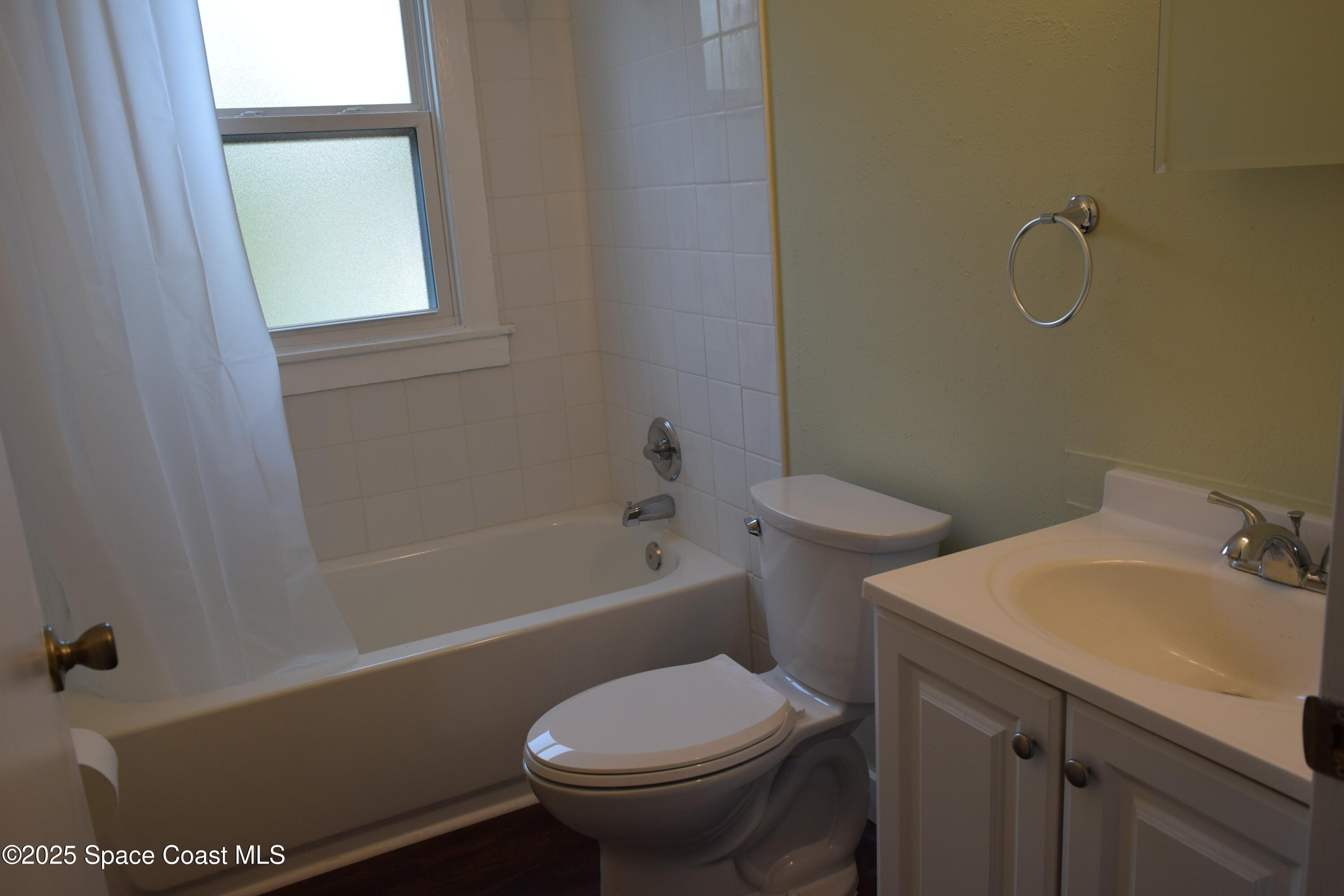 658 Young Street, Unit 2 Melbourne, FL 32935 - Photo 13 of 15 a bathroom with a sink toilet and bathtub