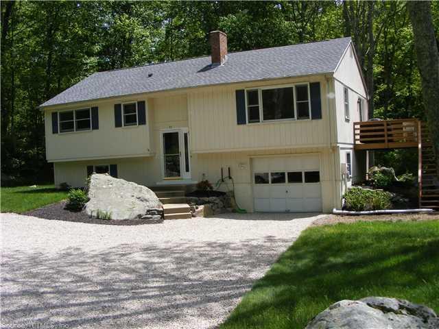 57 Quaker Farm Road Groton, CT 06355 - Photo 1 of 1 a front view of a house with a yard