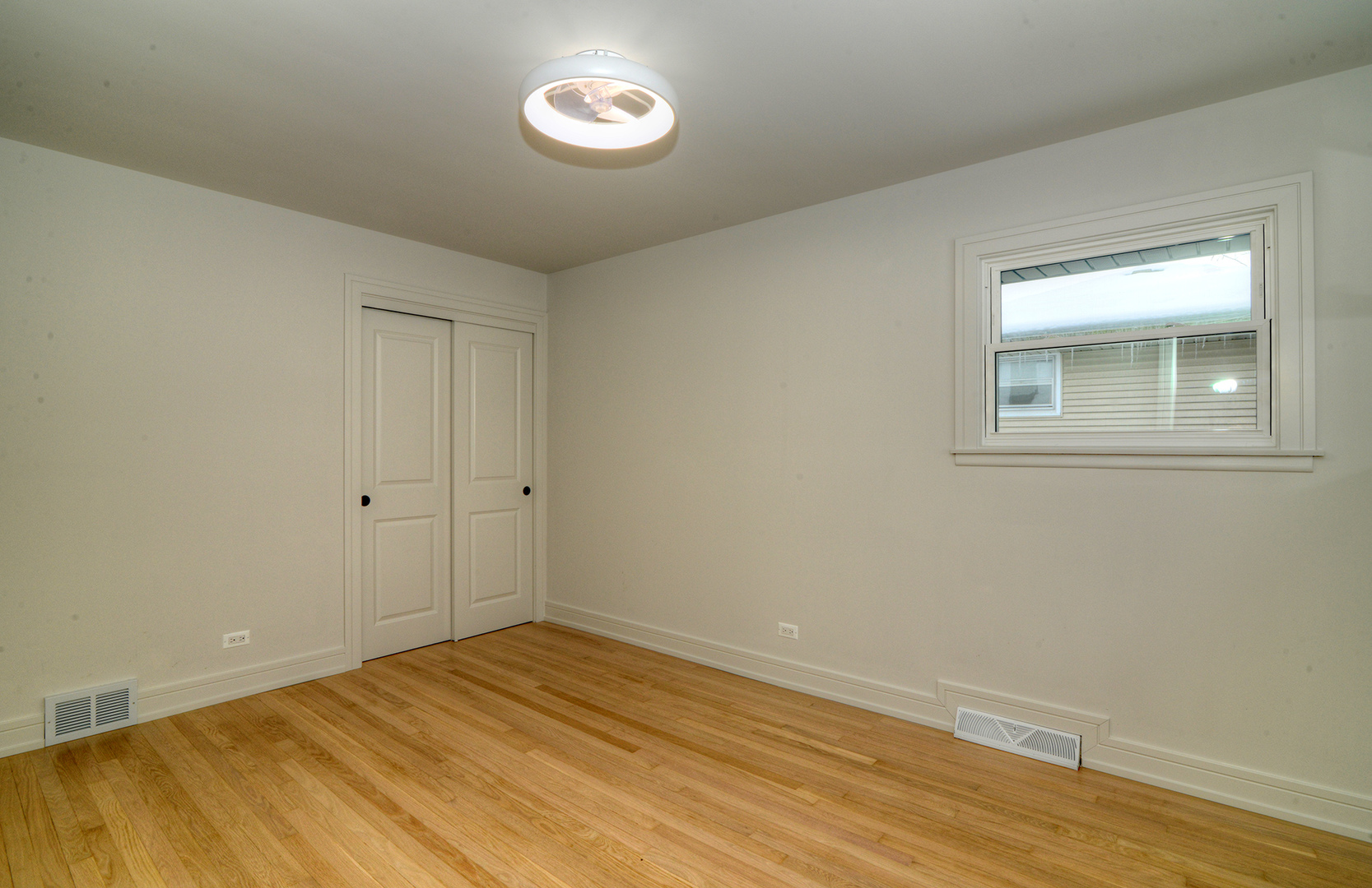 324 Parkside Avenue Itasca, IL 60143 - Photo 20 of 38 a view of a room with wooden floor and white walls