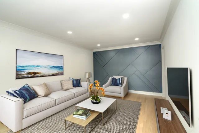 a living room with furniture and a rug