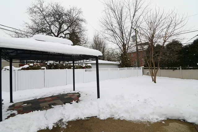 a view of a park with iron fence