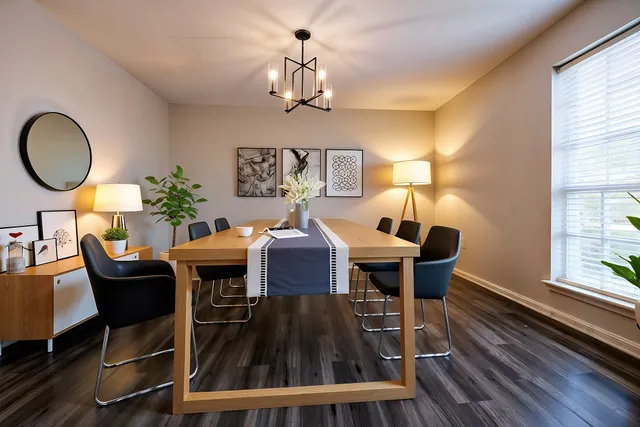 a view of a dining room with furniture window and wooden floor