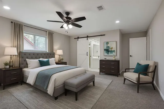 a bedroom with a bed and furniture