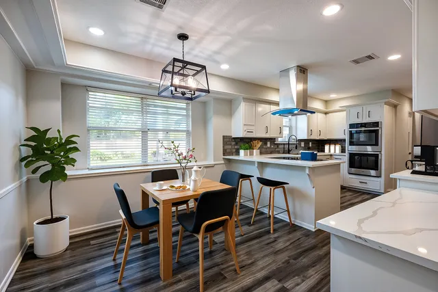 a view of a dining room with furniture window and wooden floor