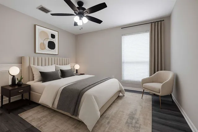 a bedroom with bed and a window