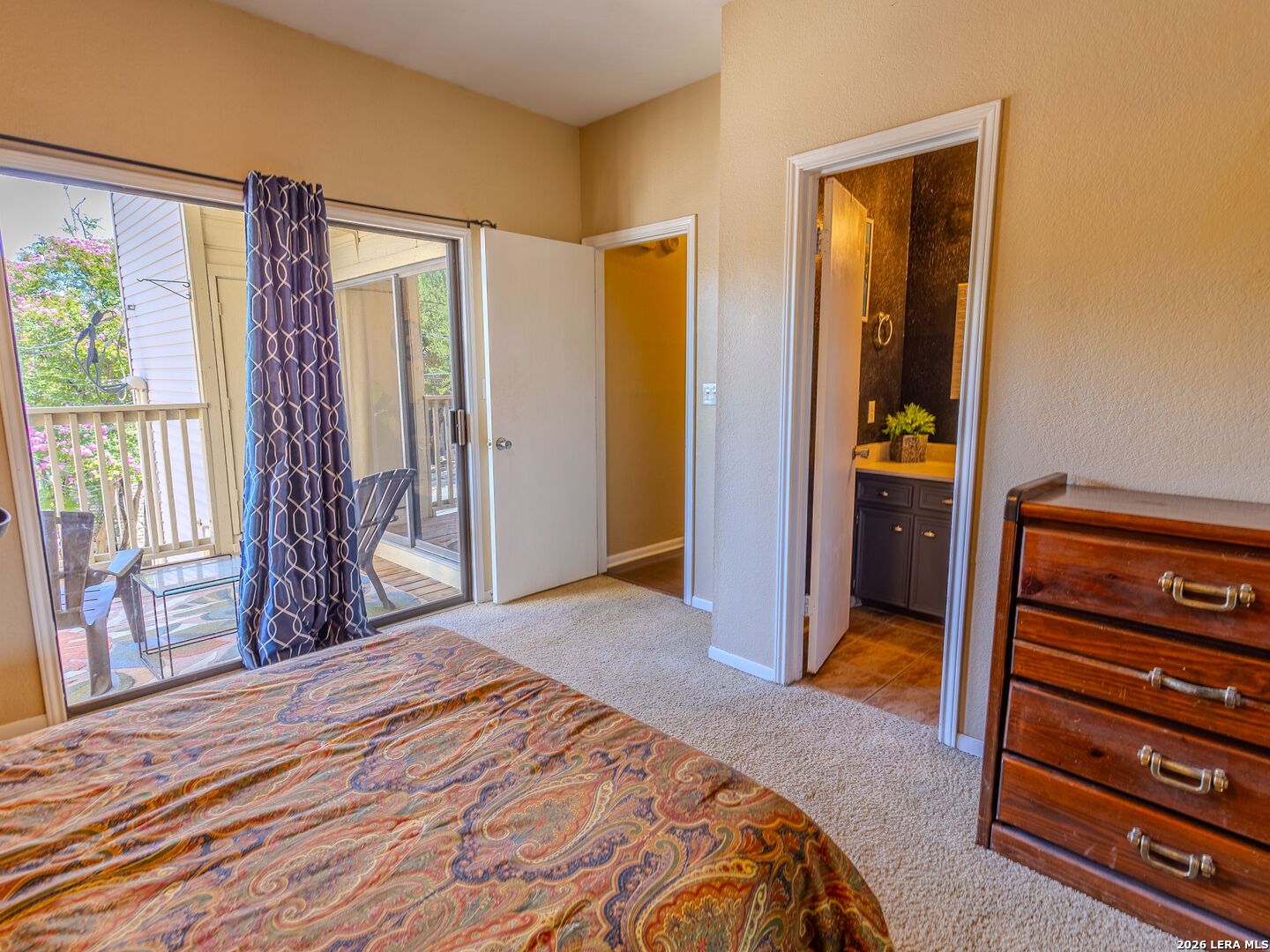 1013 Chestnut Street, Unit C4 San Marcos, TX 78666 - Photo 8 of 22 a bedroom with a bed and a dresser