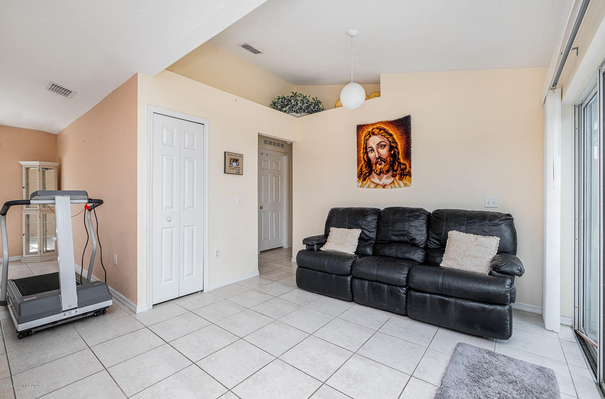 498 Scarlet Road Southwest Palm Bay, FL 32908 - Photo 9 of 24 a living room with furniture