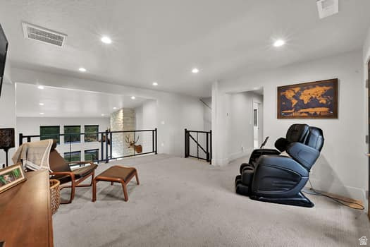 1327 West 500 North Mapleton, UT 84664 - Photo 43 of 54 Spacious loft area featuring light gray carpeting, recessed lighting, and a contemporary black metal railing overlooking the lower level