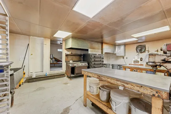 a kitchen with stainless steel appliances kitchen island granite countertop lots of counter top space