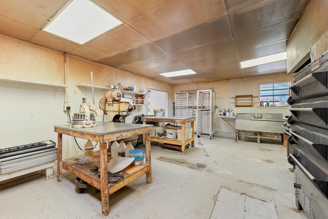 2915 Kashmere Street Houston, TX 77026 - Photo 12 of 20 a kitchen with stainless steel appliances kitchen island granite countertop lots of counter top space