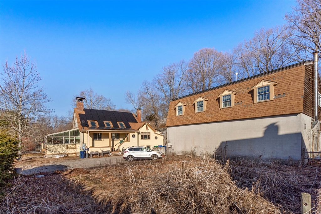 103 Thurston Road Newton, MA 02464 - Photo 2 of 3 a front view of a house with a yard