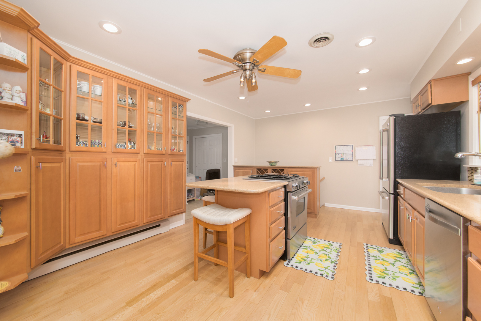 475 Amherst Avenue Des Plaines, IL 60016 - Photo 13 of 29 a large kitchen with stainless steel appliances granite countertop a stove and a refrigerator