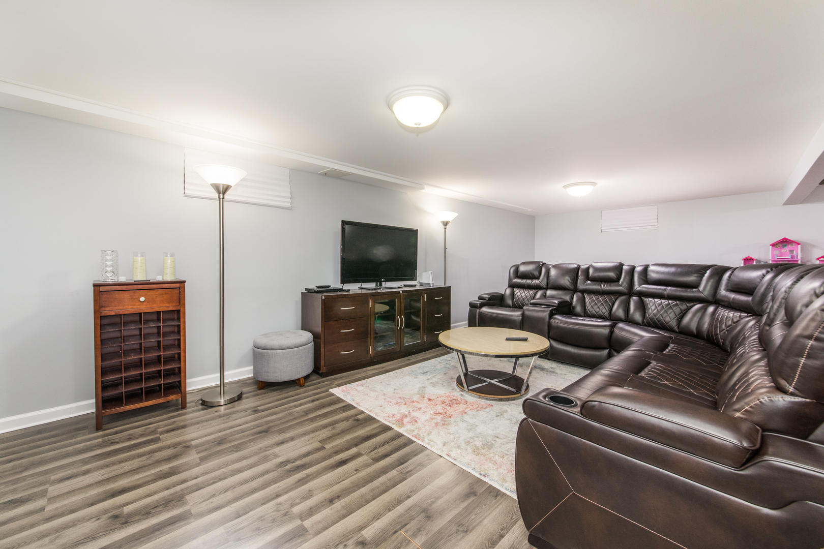 475 Amherst Avenue Des Plaines, IL 60016 - Photo 18 of 29 a living room with furniture and a flat screen tv