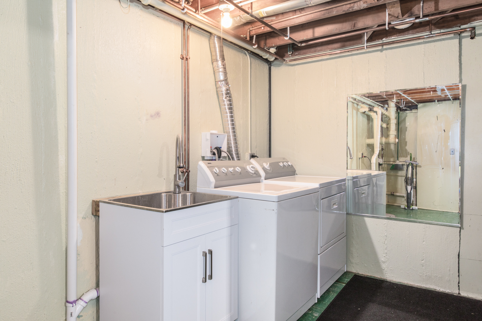 475 Amherst Avenue Des Plaines, IL 60016 - Photo 25 of 29 a bathroom with a sink and a mirror