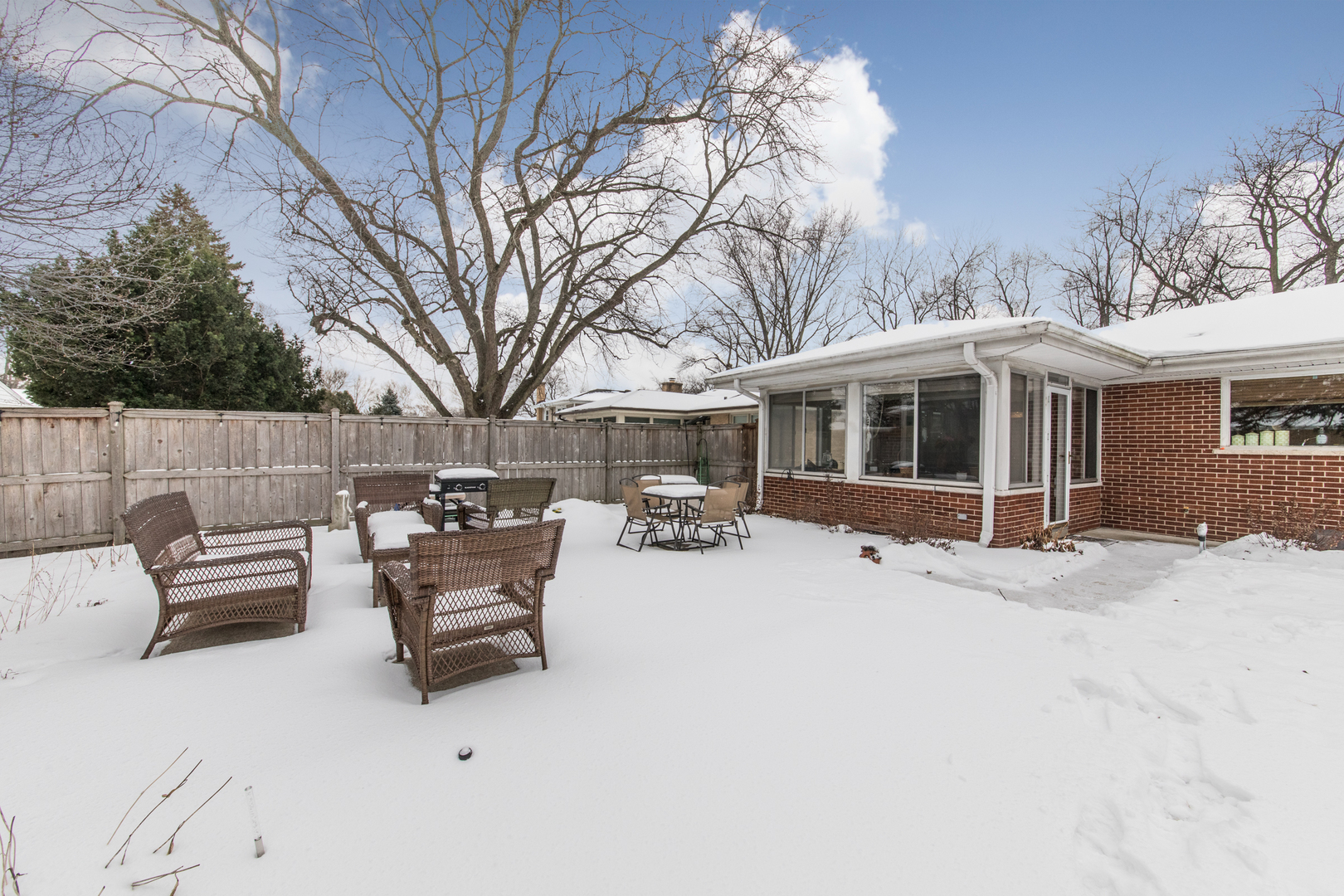 475 Amherst Avenue Des Plaines, IL 60016 - Photo 27 of 29 a view of a house with a yard covered in snow