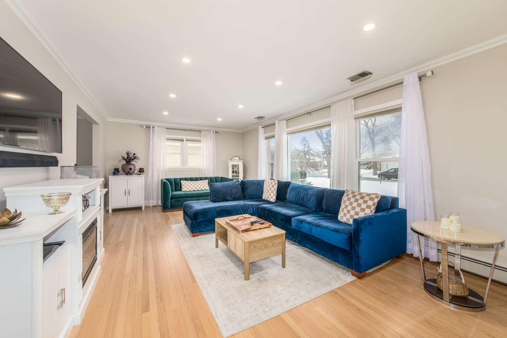 475 Amherst Avenue Des Plaines, IL 60016 - Photo 4 of 29 a living room with furniture fireplace and a large window