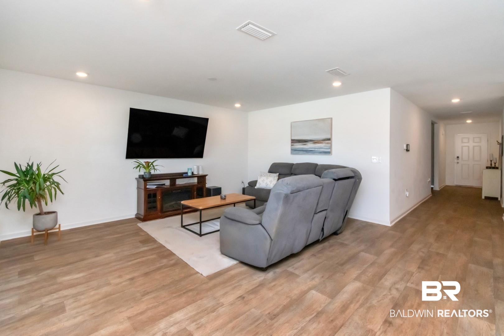 10921 Northern Dancer Court Daphne, AL 36526 - Photo 10 of 32 Living room featuring light hardwood / wood-style floors