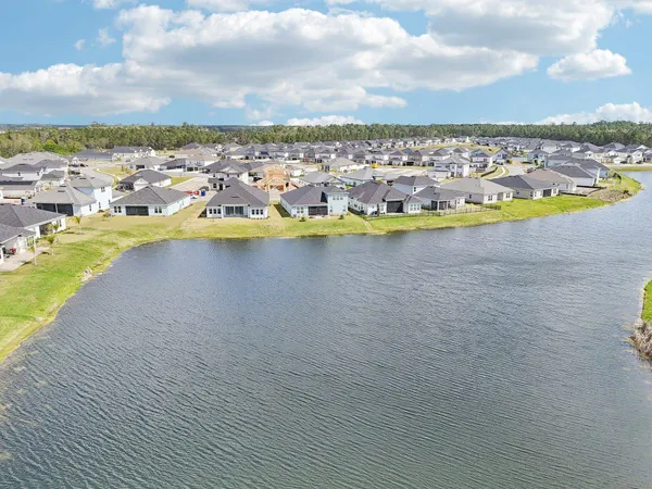 an aerial view of a house with a swimming pool