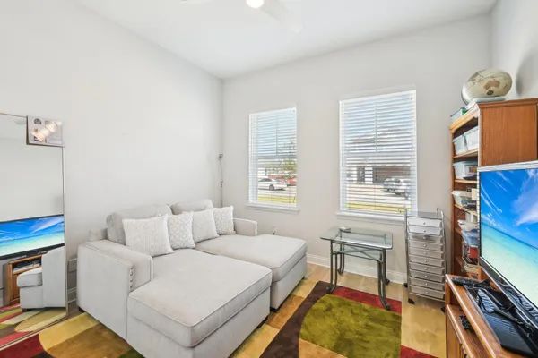 a living room with furniture and a large window