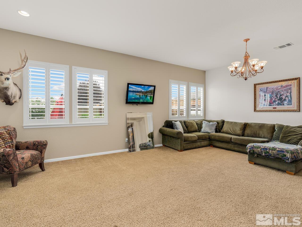 10550 Apple Mill Court Reno, NV 89521 - Photo 4 of 27 a living room with furniture and a window
