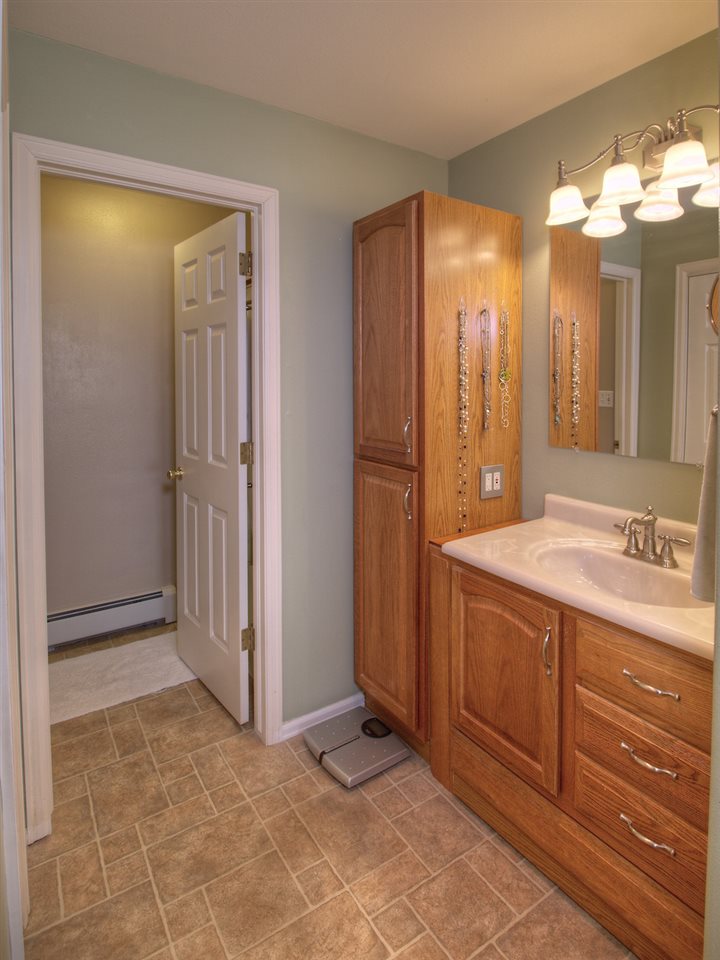 2949 Erika Road Grand Junction, CO 81504 - Photo 15 of 20 a bathroom with a granite countertop sink and a mirror