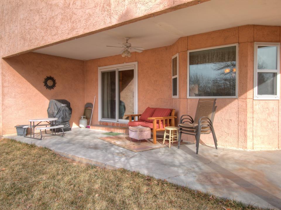 2949 Erika Road Grand Junction, CO 81504 - Photo 16 of 20 a living room with furniture a flat screen tv and a large window