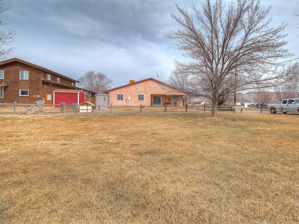 2949 Erika Road Grand Junction, CO 81504 - Photo 20 of 20 a front view of a building with large trees