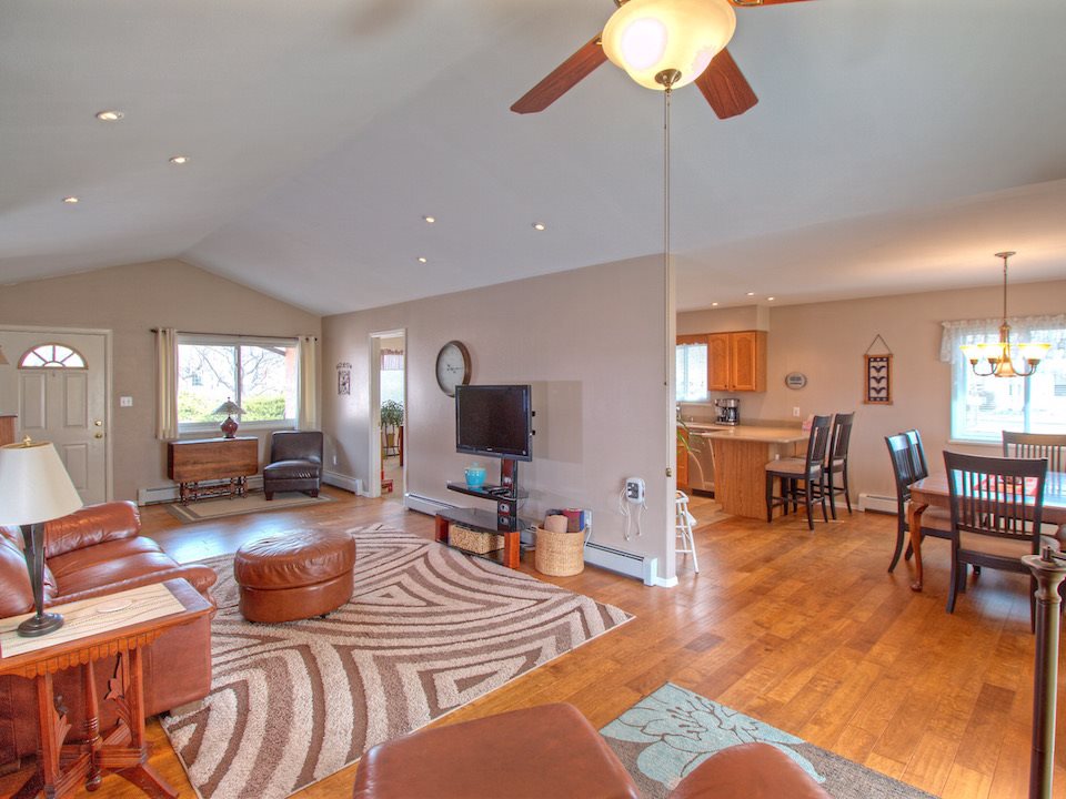 2949 Erika Road Grand Junction, CO 81504 - Photo 2 of 20 a living room with furniture a lamp and a flat screen tv