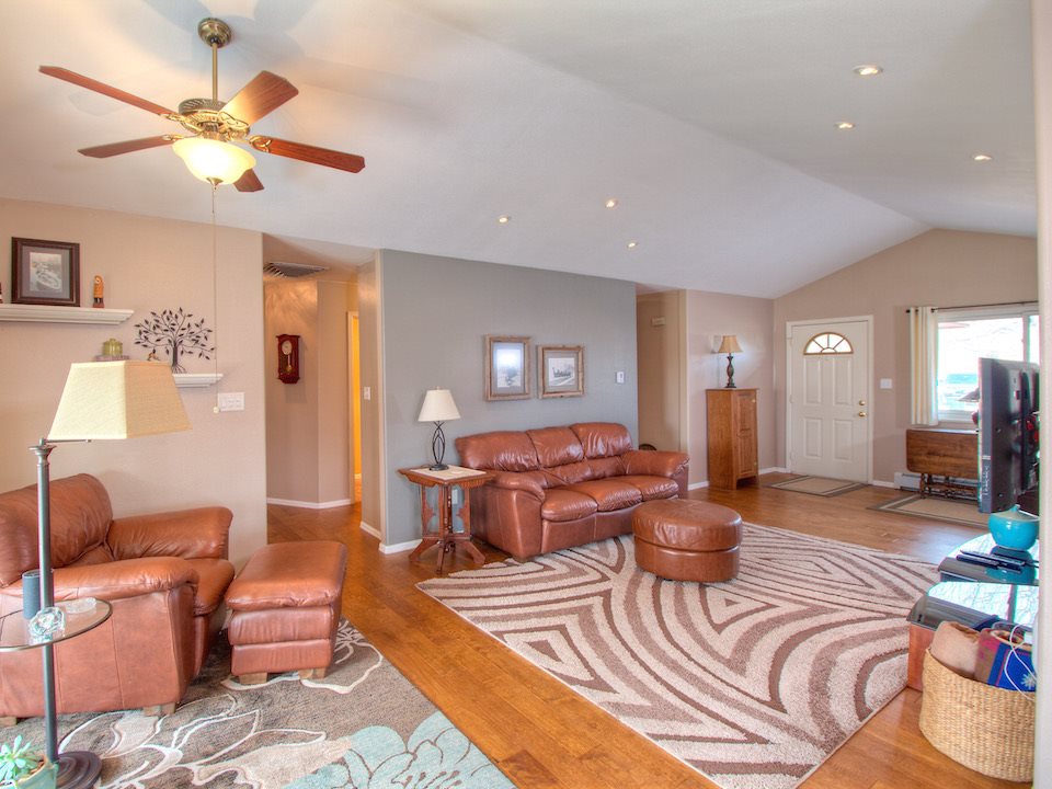 2949 Erika Road Grand Junction, CO 81504 - Photo 3 of 20 a living room with furniture and a chandelier