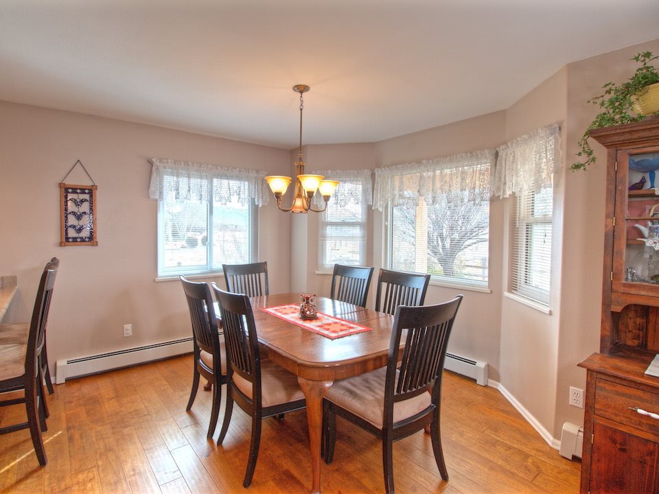 2949 Erika Road Grand Junction, CO 81504 - Photo 8 of 20 a view of a dining room with furniture window and wooden floor
