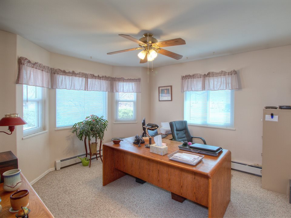 2949 Erika Road Grand Junction, CO 81504 - Photo 10 of 20 a living room with furniture and a chandelier