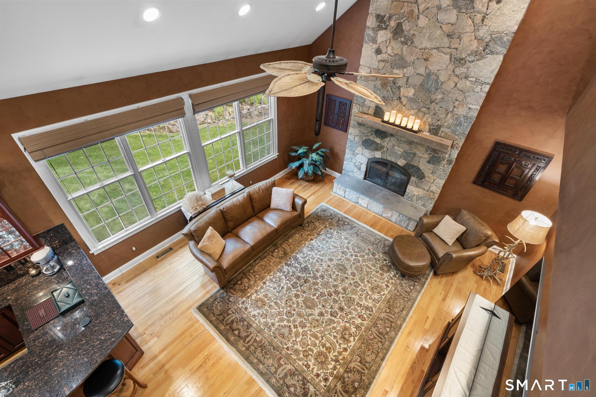 12 Logans Way Danbury, CT 06811 - Photo 11 of 40 a living room with furniture and a floor to ceiling window