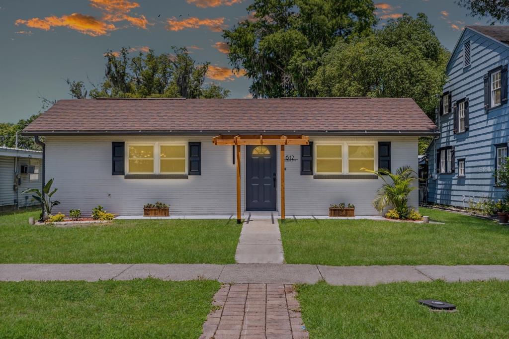 a front view of a house with a yard