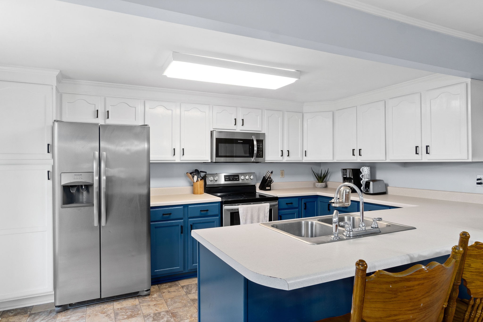 4696 Chapel Hill Road Southside, TN 37171 - Photo 12 of 36 a kitchen with stainless steel appliances a sink a stove a refrigerator and cabinets