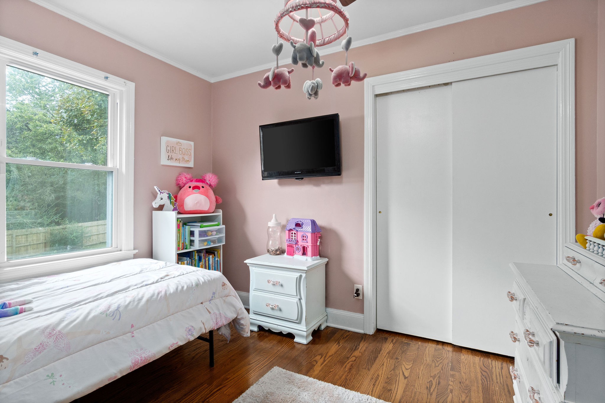 4696 Chapel Hill Road Southside, TN 37171 - Photo 24 of 36 a bedroom with a bed and a flat screen tv