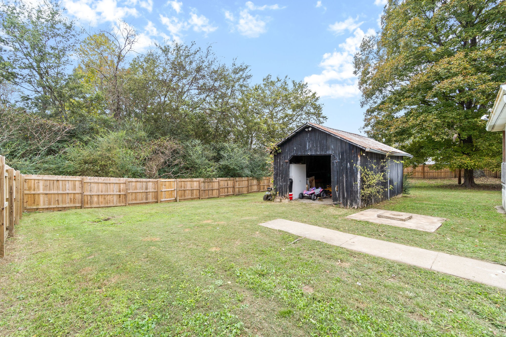4696 Chapel Hill Road Southside, TN 37171 - Photo 31 of 36 a view of a house with a yard and large trees