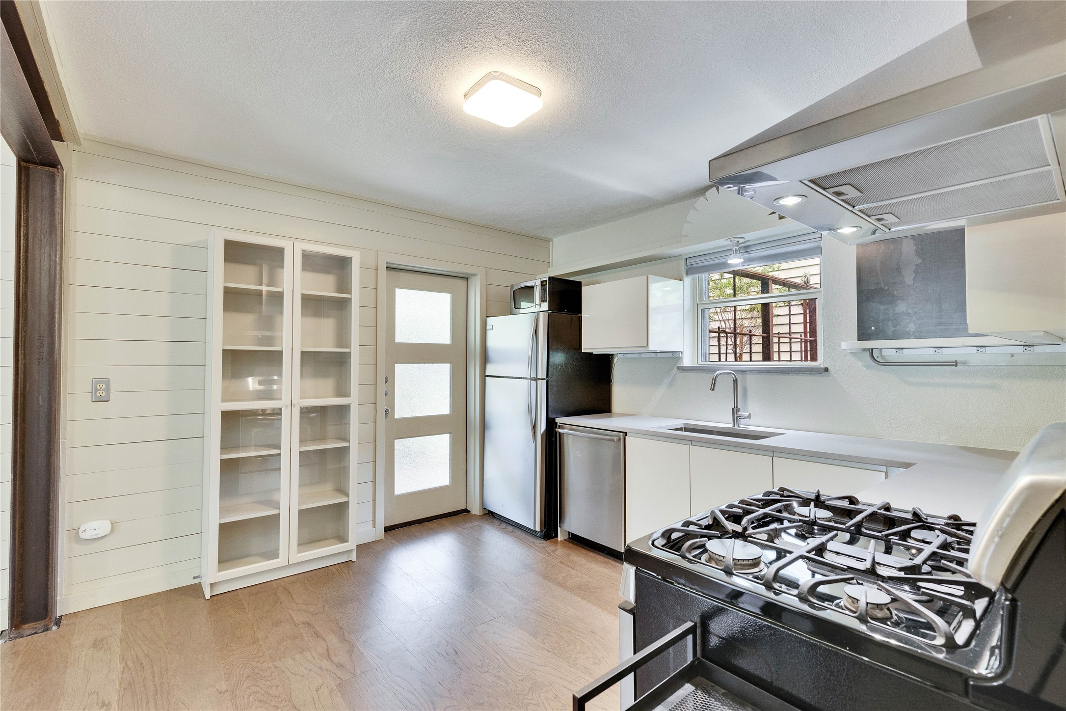 1306 Norwood Road, Unit A Austin, TX 78722 - Photo 10 of 21 Culinary delights await in this modern kitchen with stainless steel appliances and plentiful counter space.