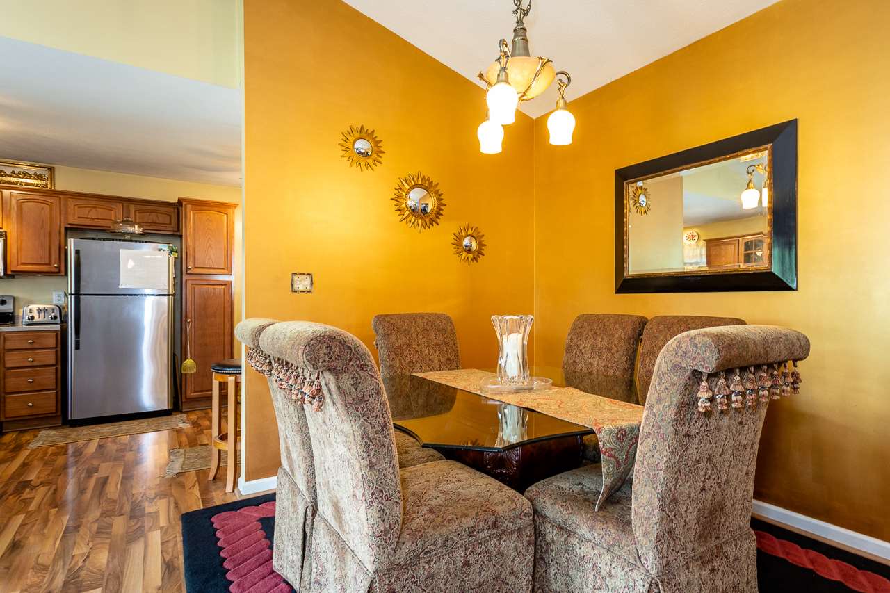 128 Gentry Road Weyers Cave, VA 24486 - Photo 20 of 48 a view of a dining room with furniture and wooden floor