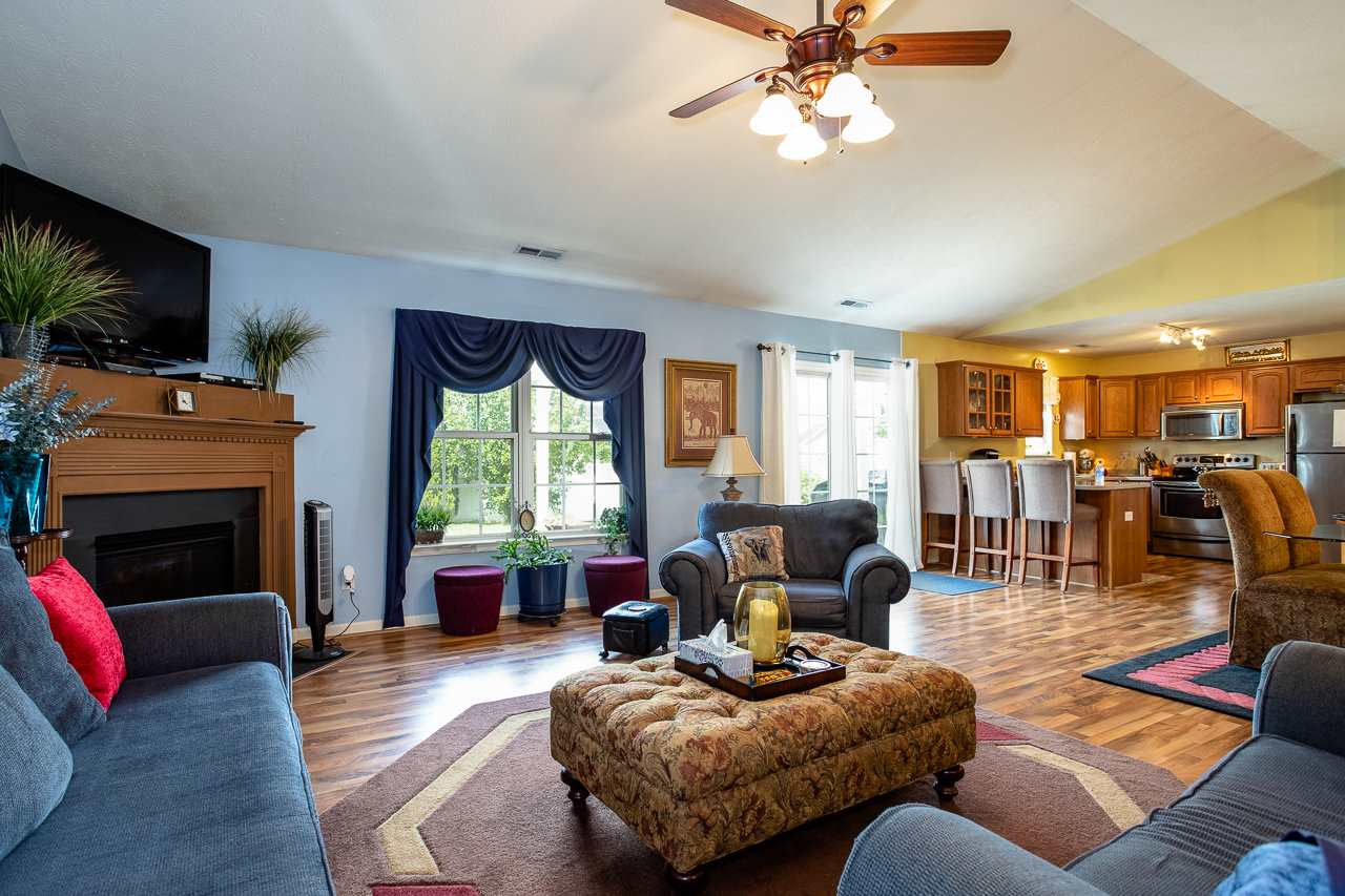 128 Gentry Road Weyers Cave, VA 24486 - Photo 2 of 48 a living room with furniture fireplace and a flat screen tv