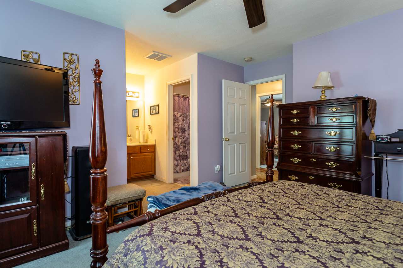 128 Gentry Road Weyers Cave, VA 24486 - Photo 24 of 48 a bedroom with a bed and a television