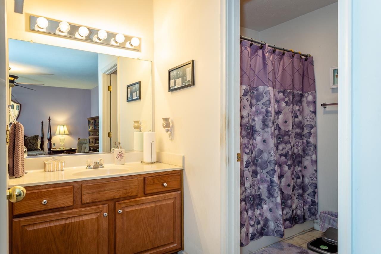 128 Gentry Road Weyers Cave, VA 24486 - Photo 25 of 48 a bathroom with a sink and a mirror