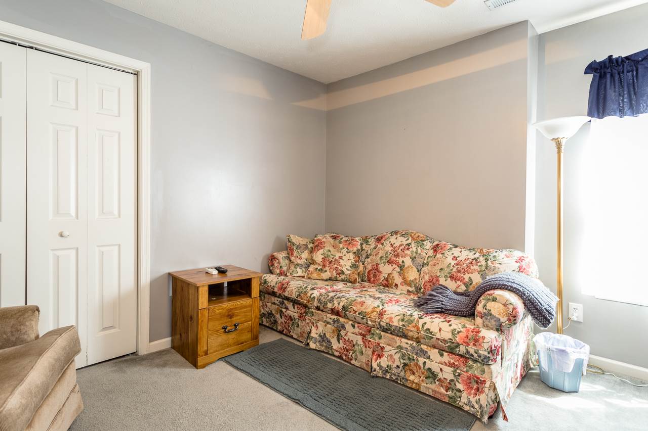 128 Gentry Road Weyers Cave, VA 24486 - Photo 26 of 48 a bedroom with a bed and a couch
