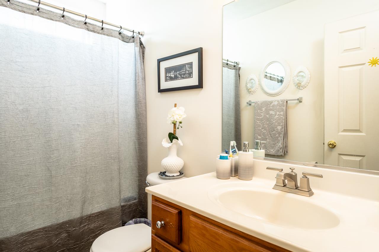 128 Gentry Road Weyers Cave, VA 24486 - Photo 28 of 48 a bathroom with a sink mirror and a toilet