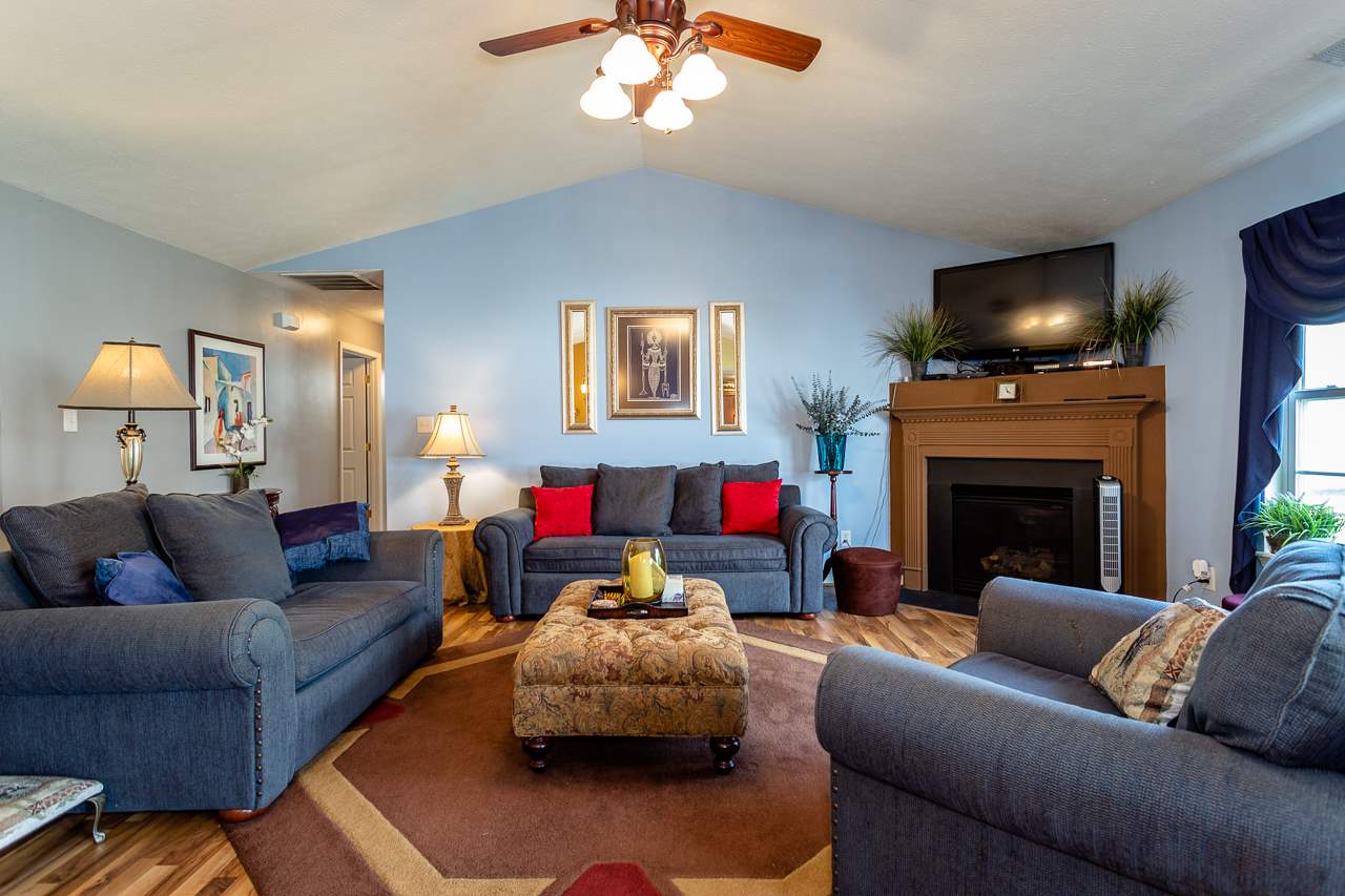 128 Gentry Road Weyers Cave, VA 24486 - Photo 3 of 48 a living room with furniture and a fireplace
