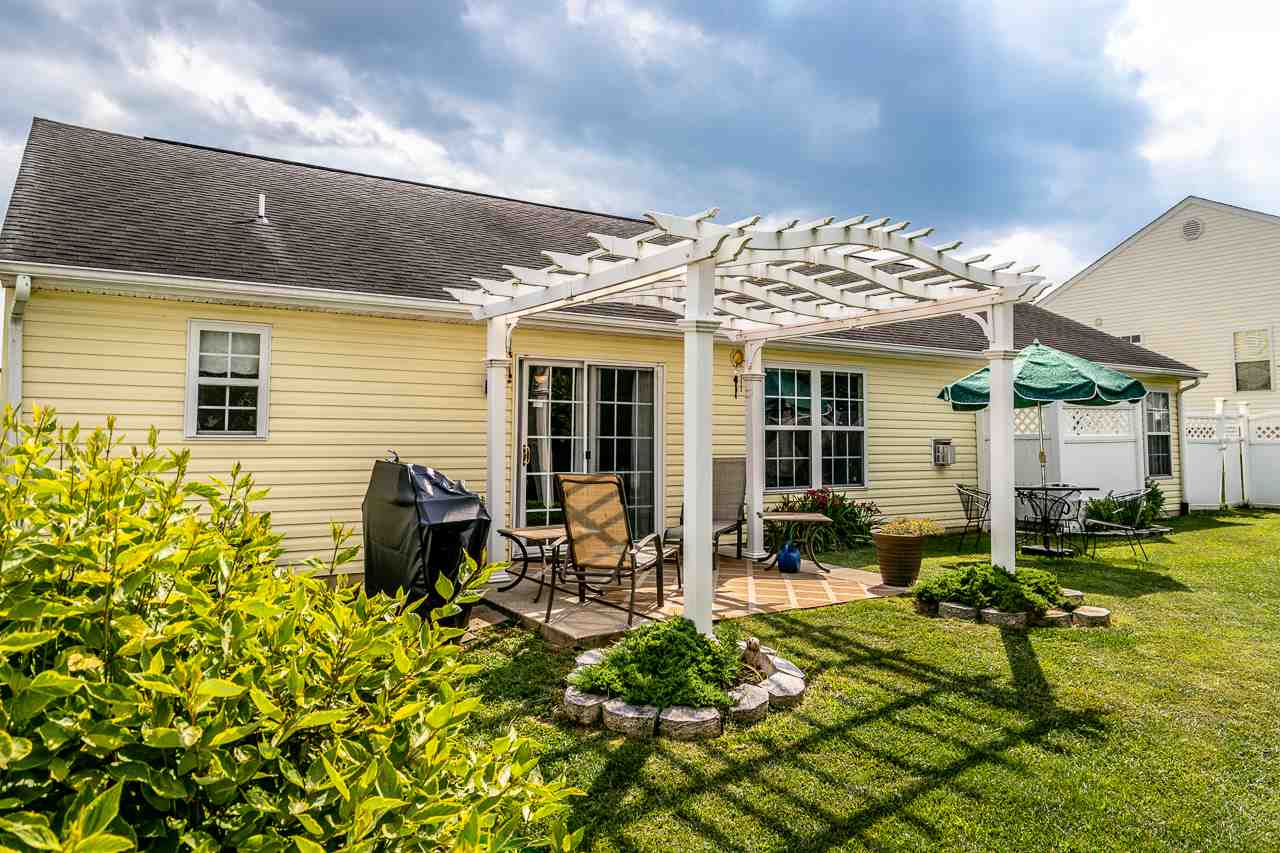 128 Gentry Road Weyers Cave, VA 24486 - Photo 40 of 48 a view of a house with sitting area and garden