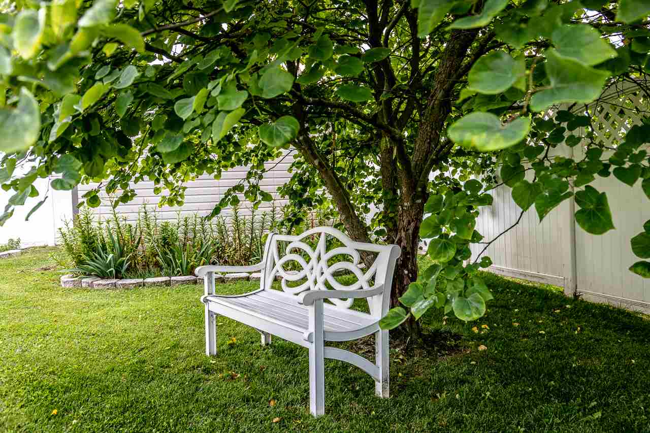 128 Gentry Road Weyers Cave, VA 24486 - Photo 47 of 48 a wooden bench sitting in a grassy field