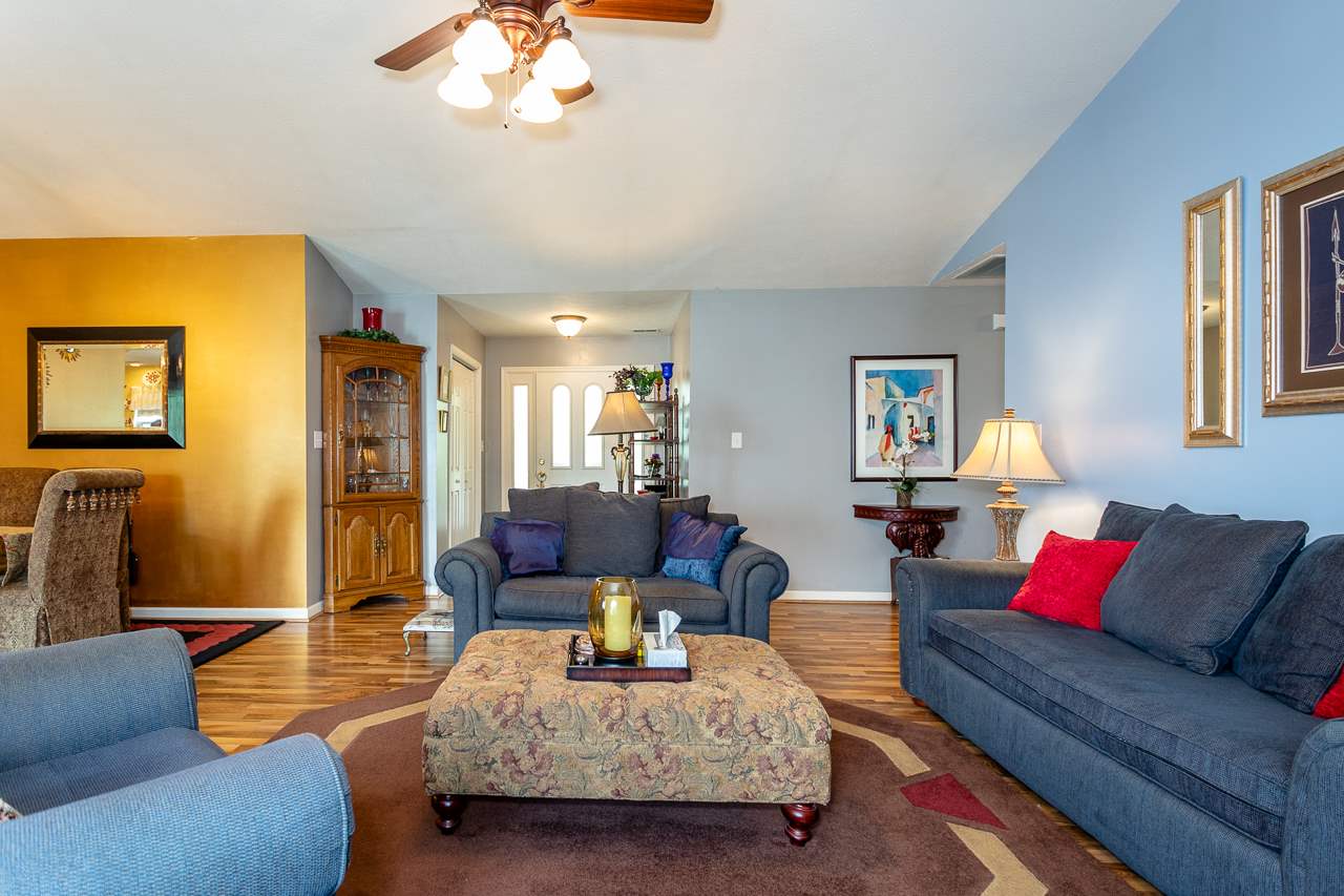 128 Gentry Road Weyers Cave, VA 24486 - Photo 7 of 48 a living room with furniture and a chandelier