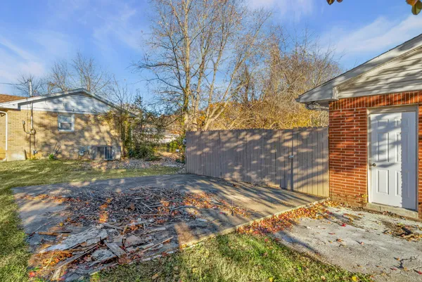 a view of a backyard with large trees